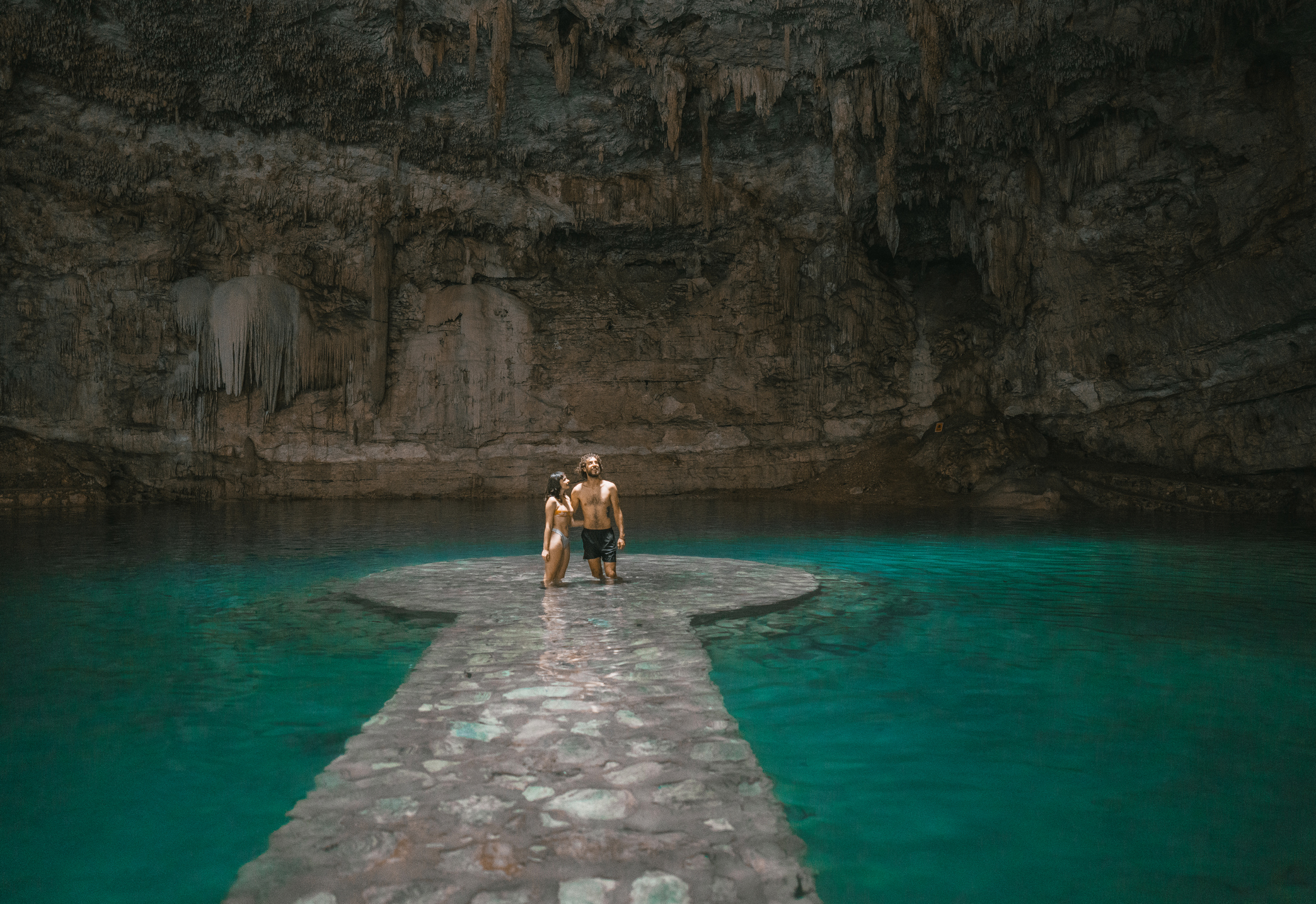 Couple standing in Cenote in Yucatan, Mexico