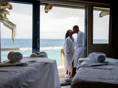 a heterosexual couple kissing, Deluxe Room, Oceanfront (Blues) | Massage in accommodation