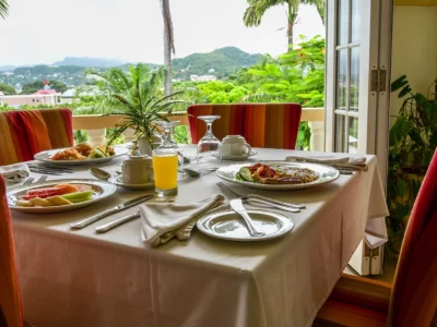 dining table with fresh fruits and breakfast at the garden resort