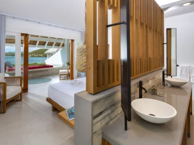 bed and bathroom view in an Antiguan resort