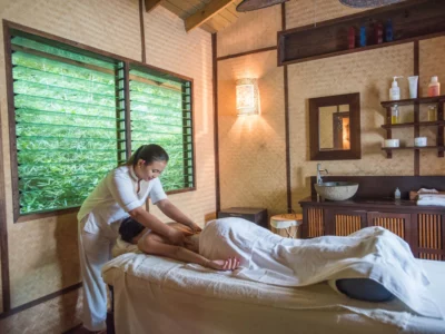 a masseuse massaging a woman inside Laluna Boutique Hotel Villas