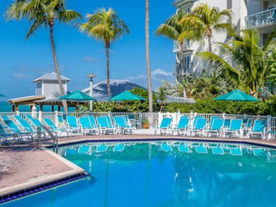 Large waterfront swimming pool and private beach.