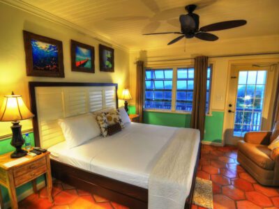 a spacious bed inside a villa in Villa Allamanda