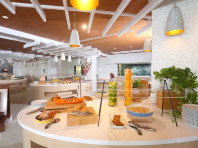 buffet table filled with food and desserts